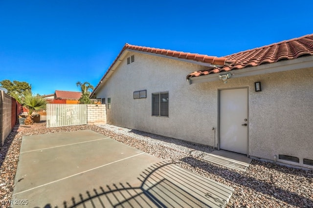 rear view of property featuring a patio