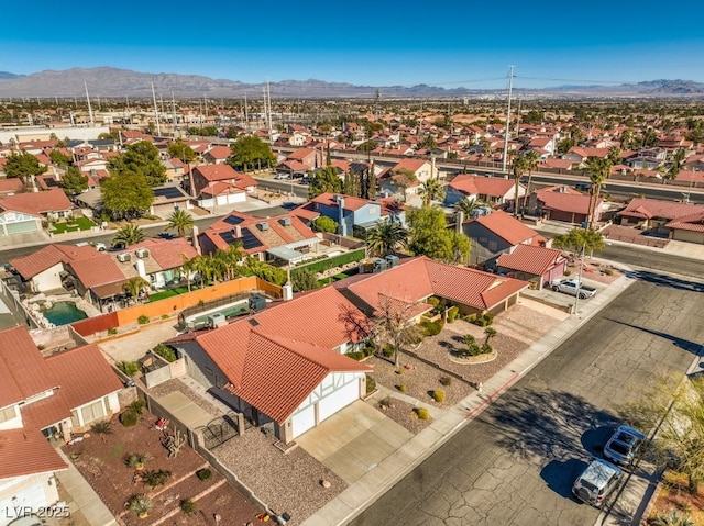 birds eye view of property featuring a mountain view