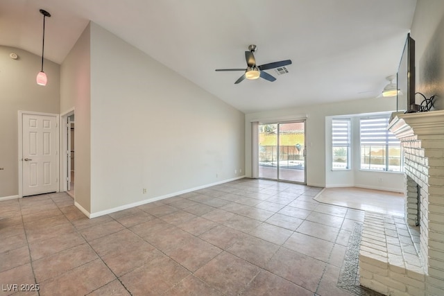 unfurnished living room featuring ceiling fan, light tile patterned floors, a fireplace, and vaulted ceiling