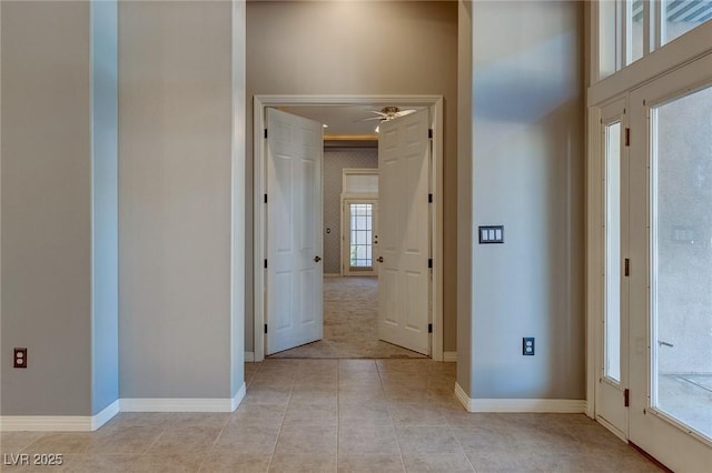 hallway featuring light tile patterned floors