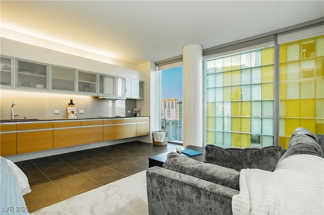 tiled living room featuring sink