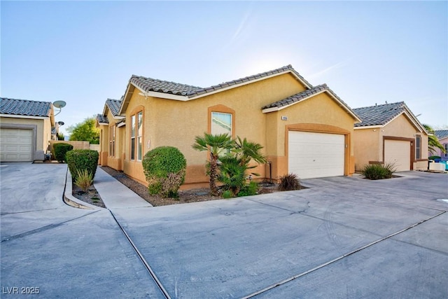 mediterranean / spanish-style house featuring a garage