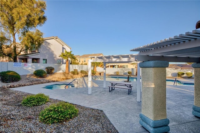 view of patio with a pergola and a community pool