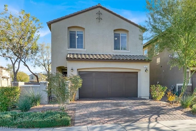 mediterranean / spanish-style house featuring a garage