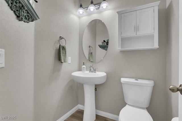 bathroom featuring toilet and sink