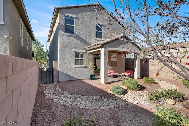 back of property with a patio area