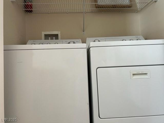 laundry area with washing machine and clothes dryer