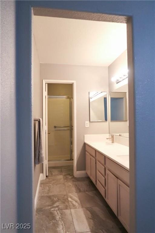 bathroom featuring vanity and walk in shower