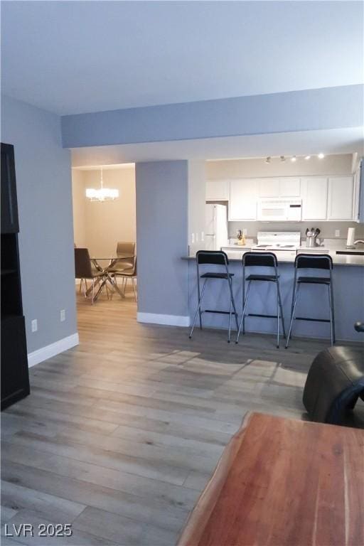 living room with light hardwood / wood-style floors