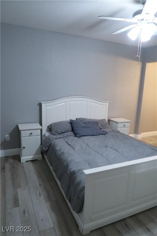 bedroom featuring ceiling fan and light hardwood / wood-style floors