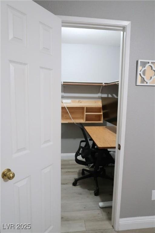 office area with light hardwood / wood-style flooring