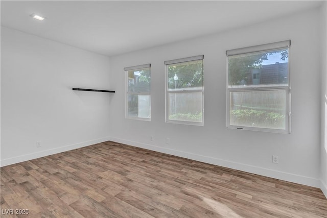 spare room with light wood-type flooring