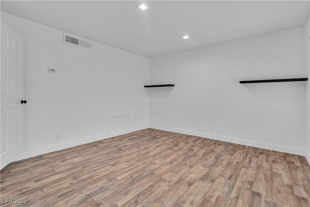 unfurnished room with light hardwood / wood-style floors