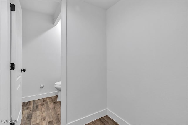 bathroom featuring toilet and hardwood / wood-style flooring