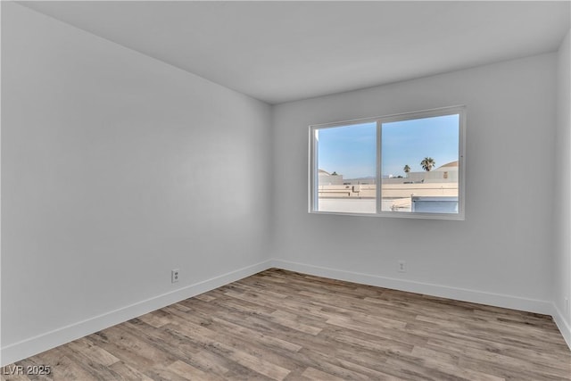 unfurnished room with light hardwood / wood-style flooring