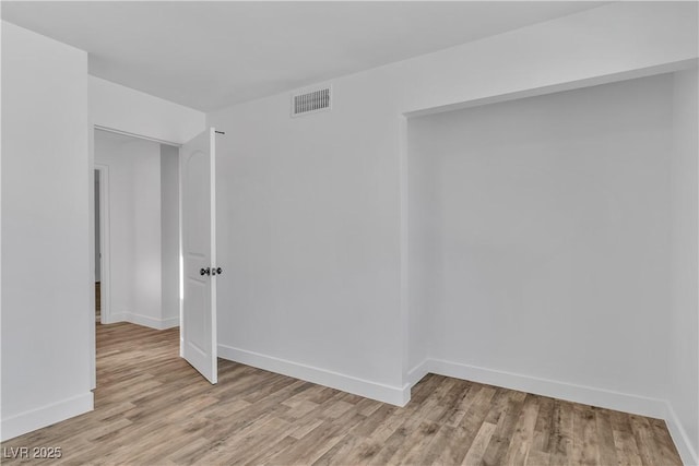 unfurnished room featuring light hardwood / wood-style flooring