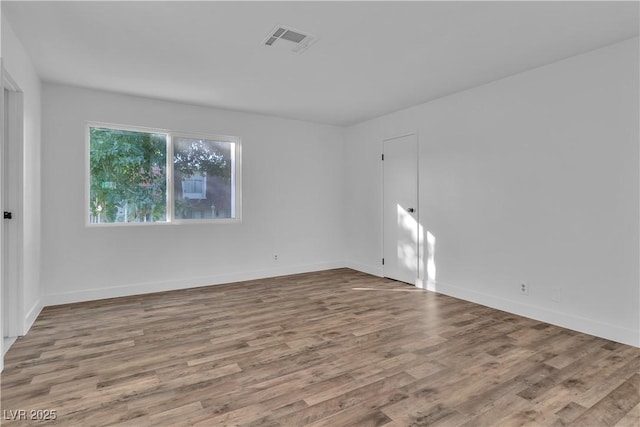 empty room with wood-type flooring