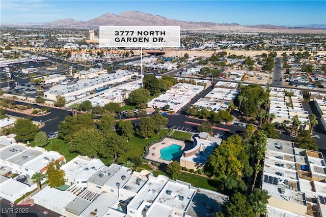 birds eye view of property with a mountain view