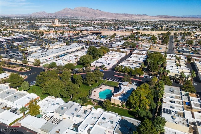 birds eye view of property with a mountain view