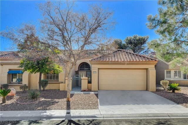 mediterranean / spanish-style home featuring a garage