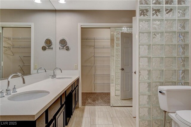 bathroom with vanity, tile patterned floors, and toilet