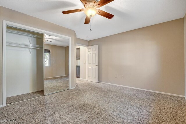 unfurnished bedroom featuring a closet, ceiling fan, and carpet