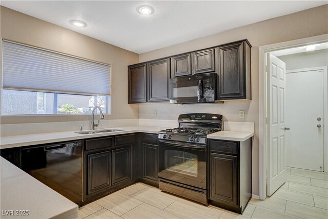 kitchen with light tile patterned flooring, sink, dark brown cabinets, and black appliances