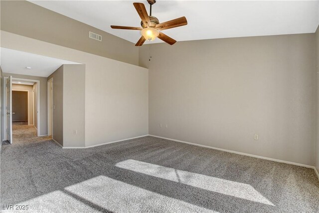 empty room with ceiling fan and carpet