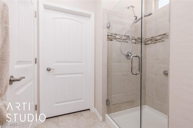 bathroom featuring tile patterned flooring and a shower with door