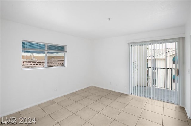 empty room with light tile patterned floors