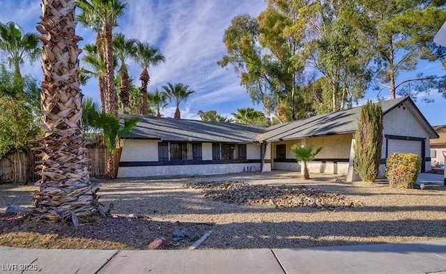 single story home with a garage