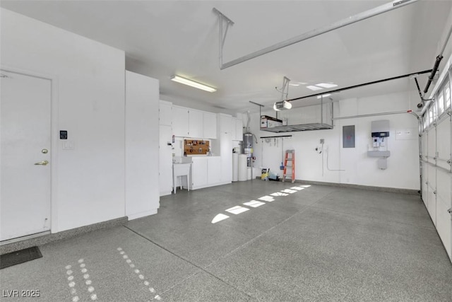 garage featuring electric panel, sink, and a garage door opener