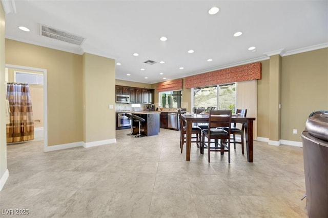 dining space featuring ornamental molding