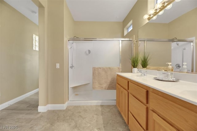 bathroom with vanity and an enclosed shower