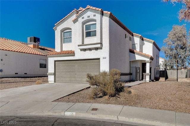 view of front of home featuring a garage and central AC