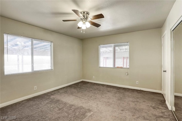 unfurnished bedroom featuring ceiling fan and carpet