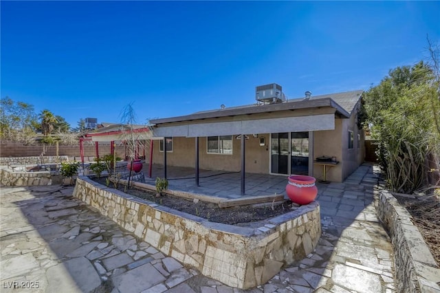 back of property with a patio area and cooling unit