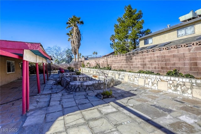 view of patio / terrace with an outdoor fire pit