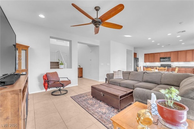 tiled living room featuring ceiling fan