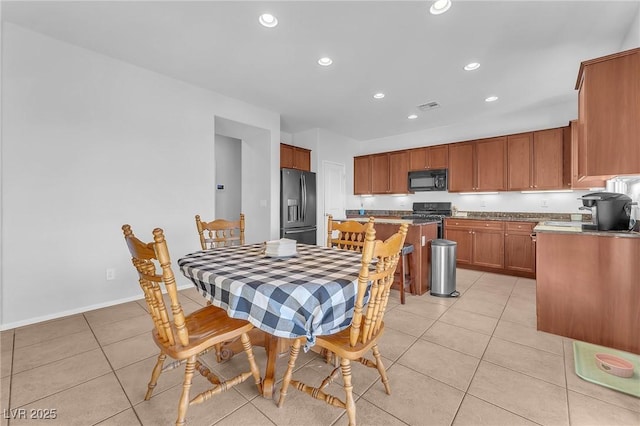 dining room featuring light tile patterned flooring