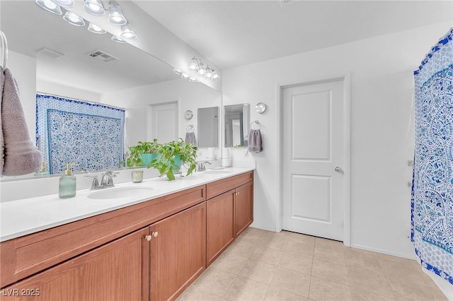 bathroom with vanity and tile patterned floors