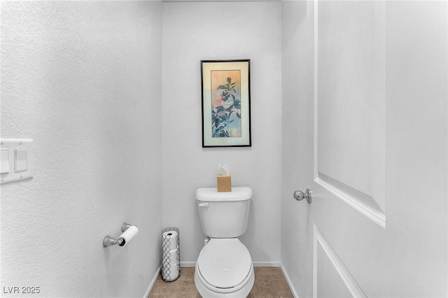 bathroom featuring tile patterned floors and toilet