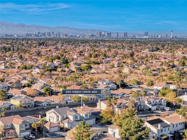 birds eye view of property with a mountain view