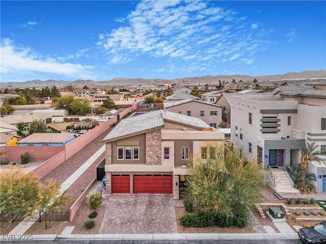 birds eye view of property featuring a mountain view