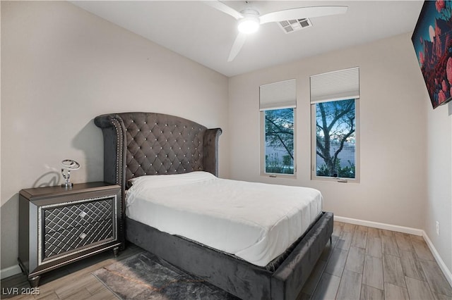 bedroom featuring ceiling fan and hardwood / wood-style flooring