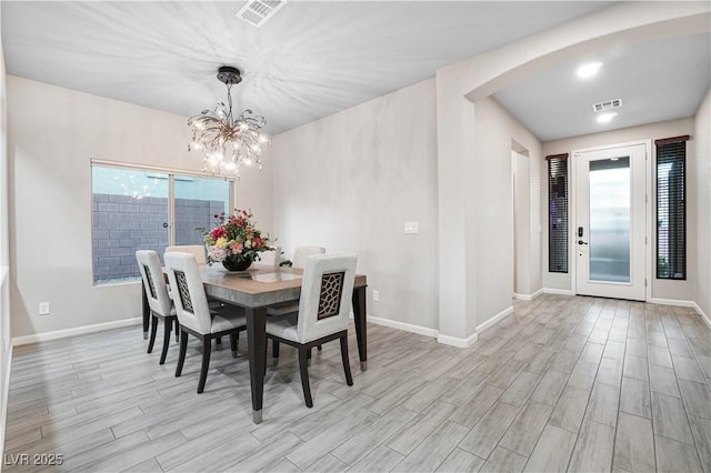 dining space featuring a notable chandelier