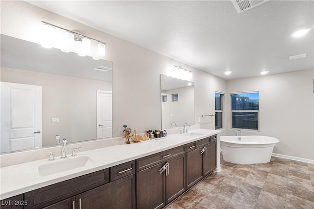 bathroom featuring a bathtub and vanity