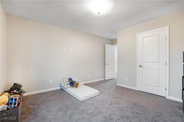 miscellaneous room featuring dark carpet