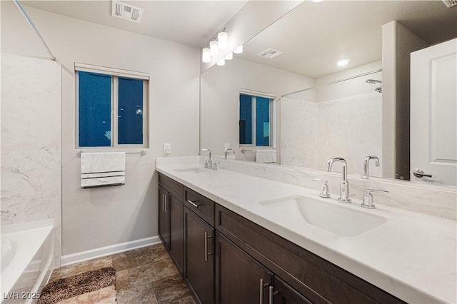 bathroom with tub / shower combination and vanity