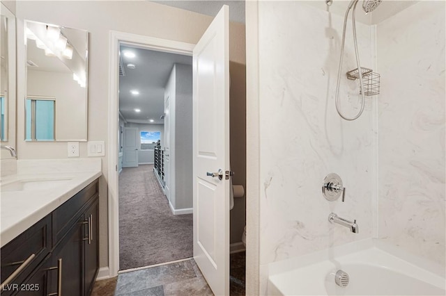 bathroom featuring bathing tub / shower combination and vanity